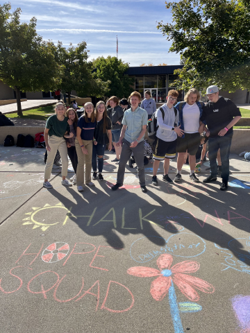 students with side walk chalk