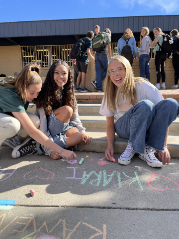 students with side walk chalk